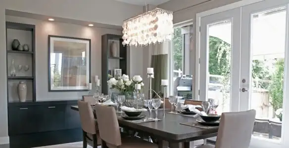 Elegant dining room chandelier installation above table in Phoenix, AZ