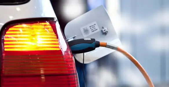 Electric car plugged into EV charger after professional installation in Phoenix, AZ