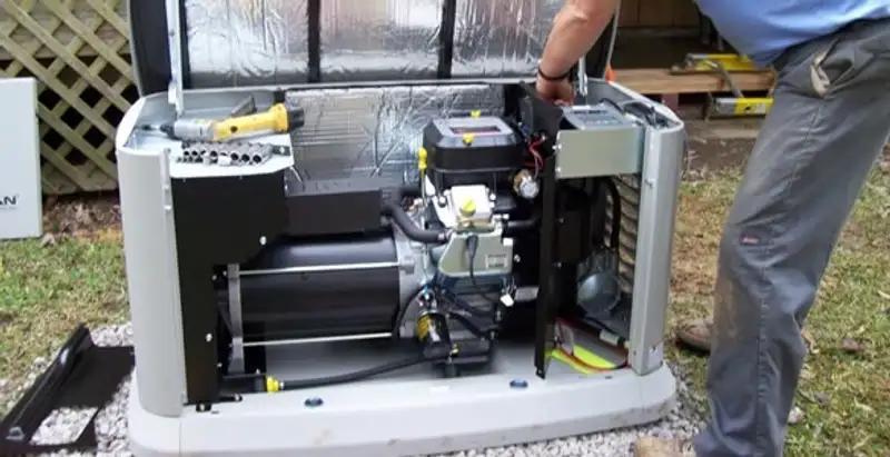 generator installation service showing technician connecting and configuring generator components in Phoenix, AZ