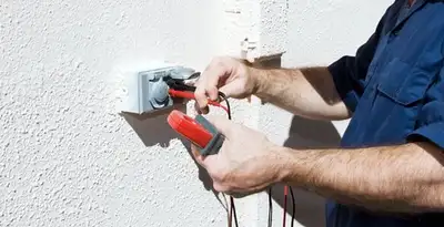 Electrician performing home electrical outlet and wiring inspection in Phoenix, AZ