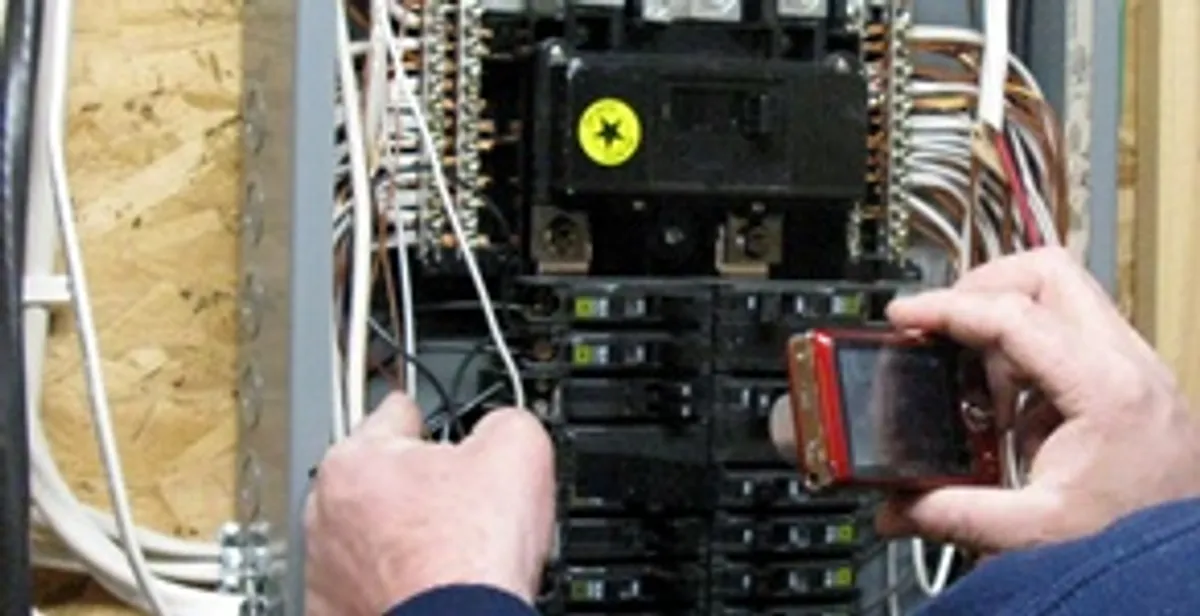Home electrical inspection of circuit breaker panel by licensed electrician in Phoenix, AZ
