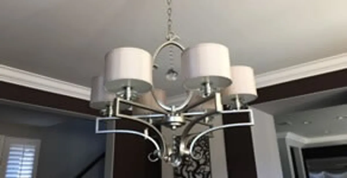 Modern chandelier installation with multiple light fixtures in Phoenix, AZ