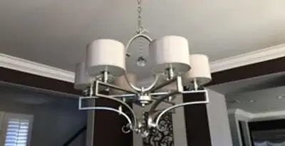 Modern chandelier installation with multiple light fixtures in Phoenix, AZ
