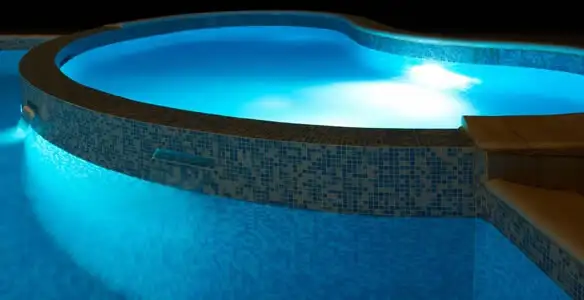 pool light installation and repair services highlighting illuminated pool interior lighting in Phoenix, AZ
