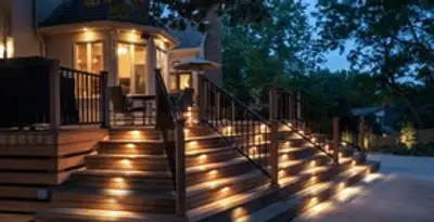 Residential electrician installing outdoor lighting for home safety in Phoenix, AZ