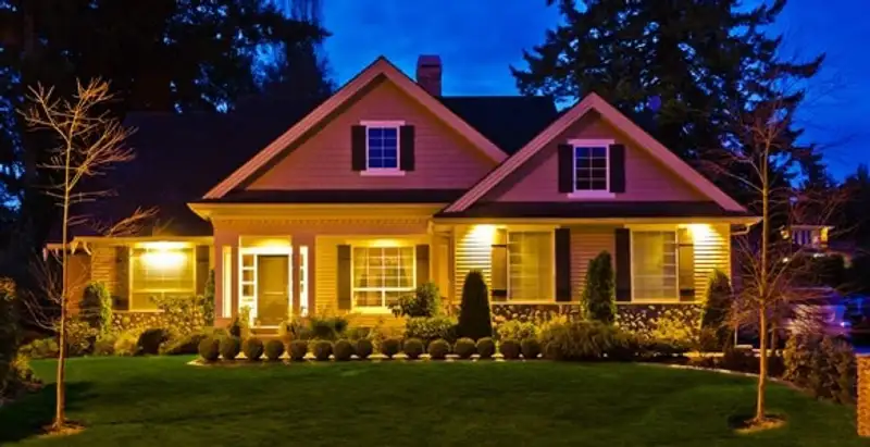 security light installation services illuminating a residential exterior at night in Phoenix, AZ